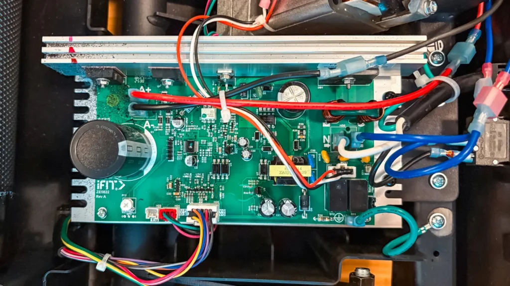 Repairs A treadmill motor control board, wired in place inside the motor compartment